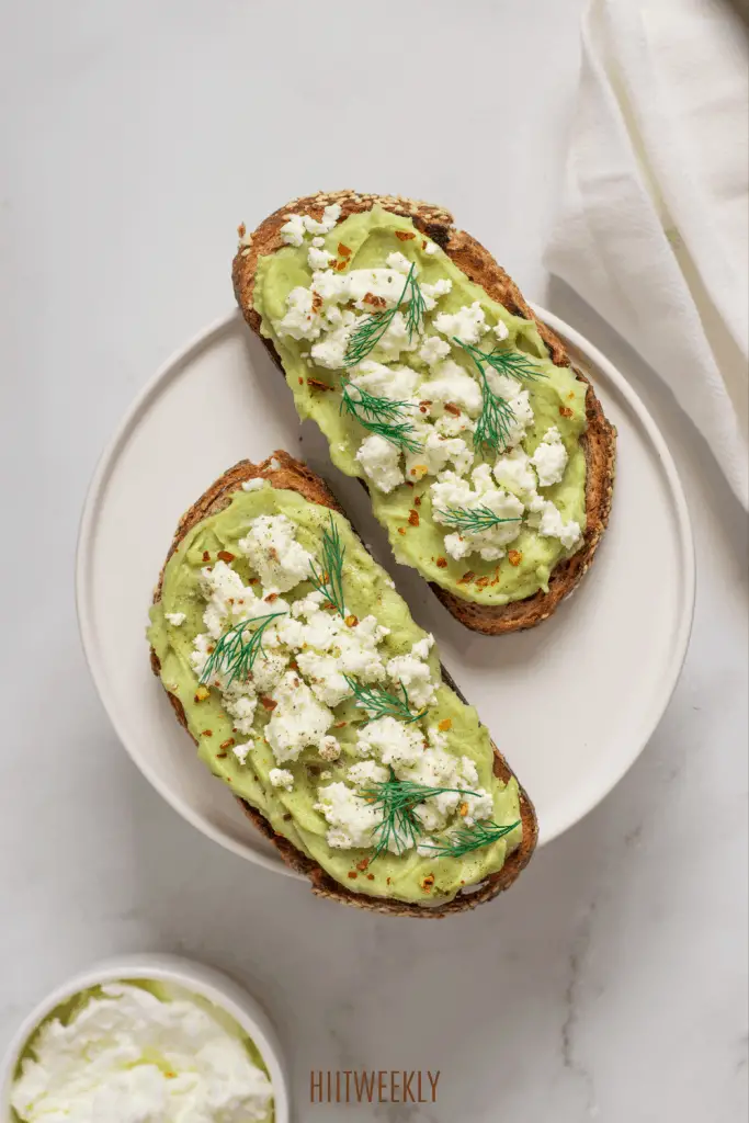 Healthy avocado on toast recipe with  added protein forom the ricotta cheese.